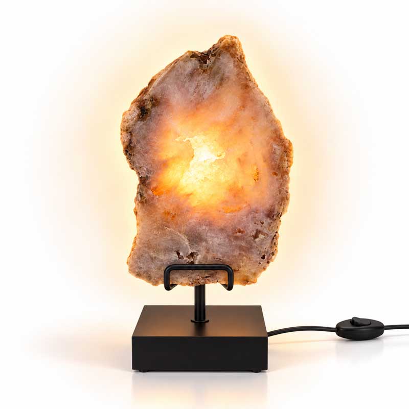 Roze Amethist Edelsteen Lamp Rose Aura met natuurlijke roze kristalstructuren, warme goudgele lichtgloed en moderne zwarte metalen standaard.